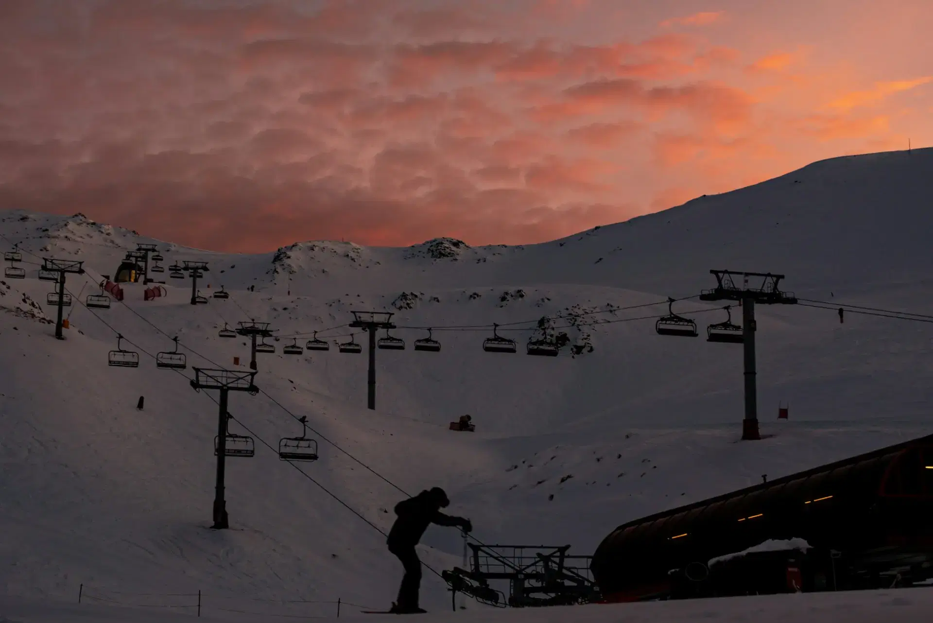Ski lift climbing a snowy South Island mountain